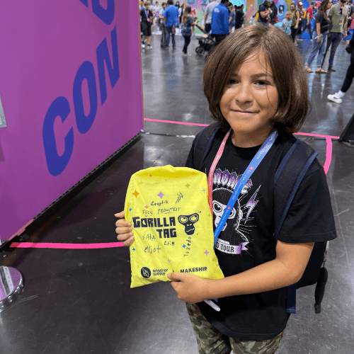 Fan at Vidcon holding signed Gorilla Tag merchandise bag